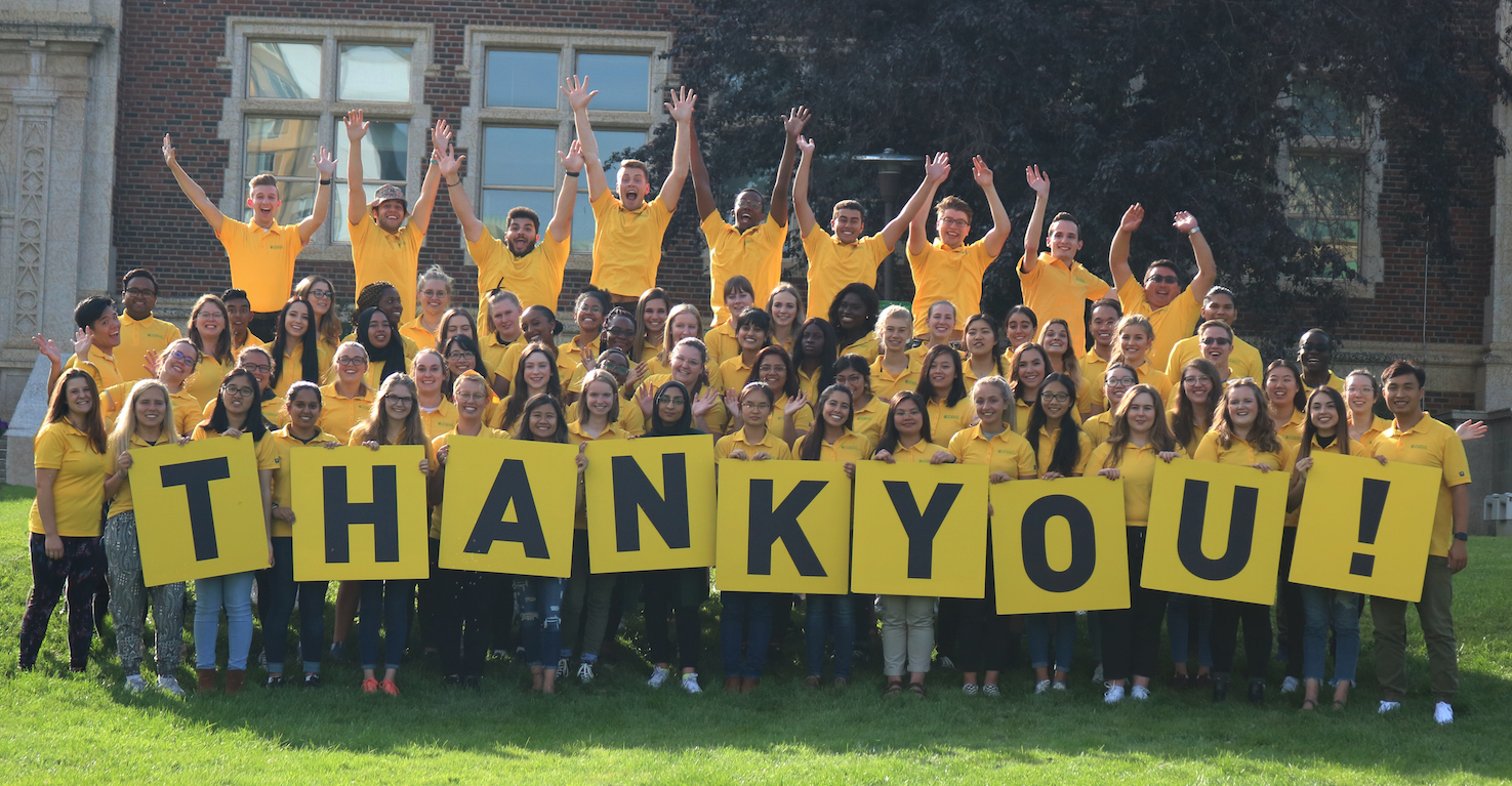 Students holding a thank you sign