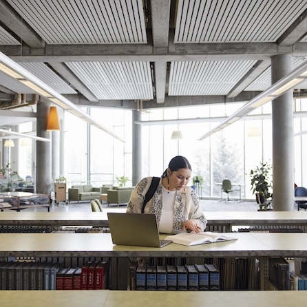Woman studying at the library