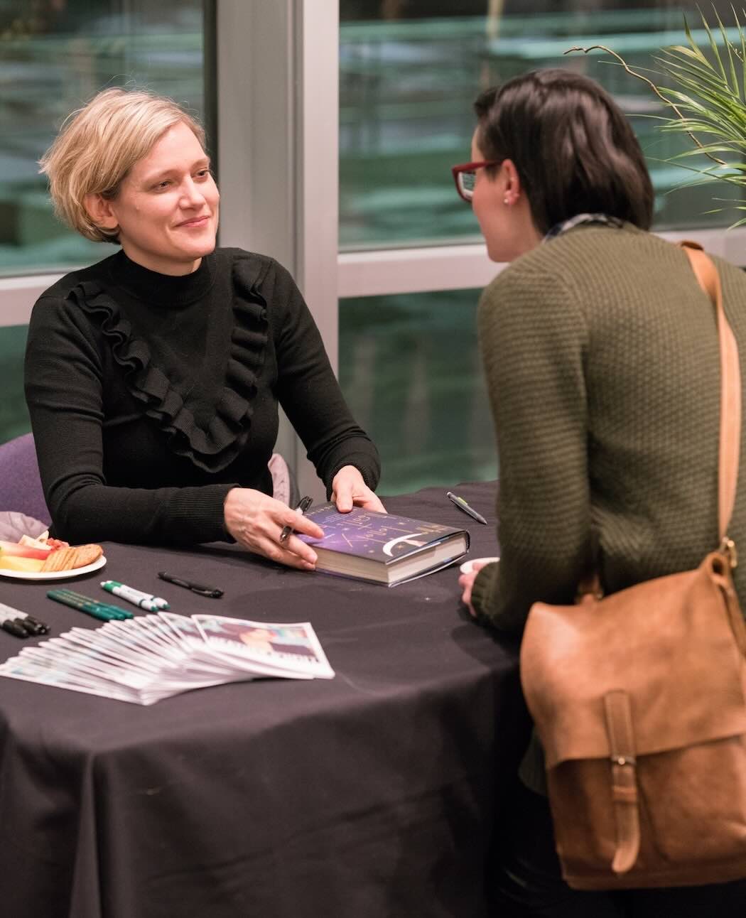 Photo of Heather O'Neill Signing a Book at the 2017 Kreisel Lecture