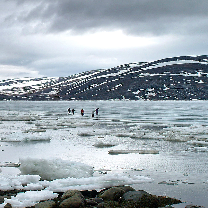 Inuit walking and fishing on the ice in Wakeham Bay, Nunavik.