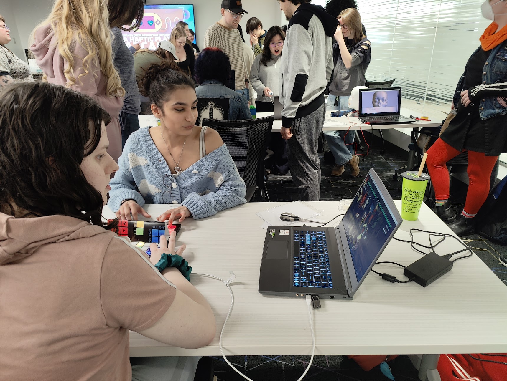 Myles and Ash demonstrating their custom launchpad controller with popular fighting game, Tekken.