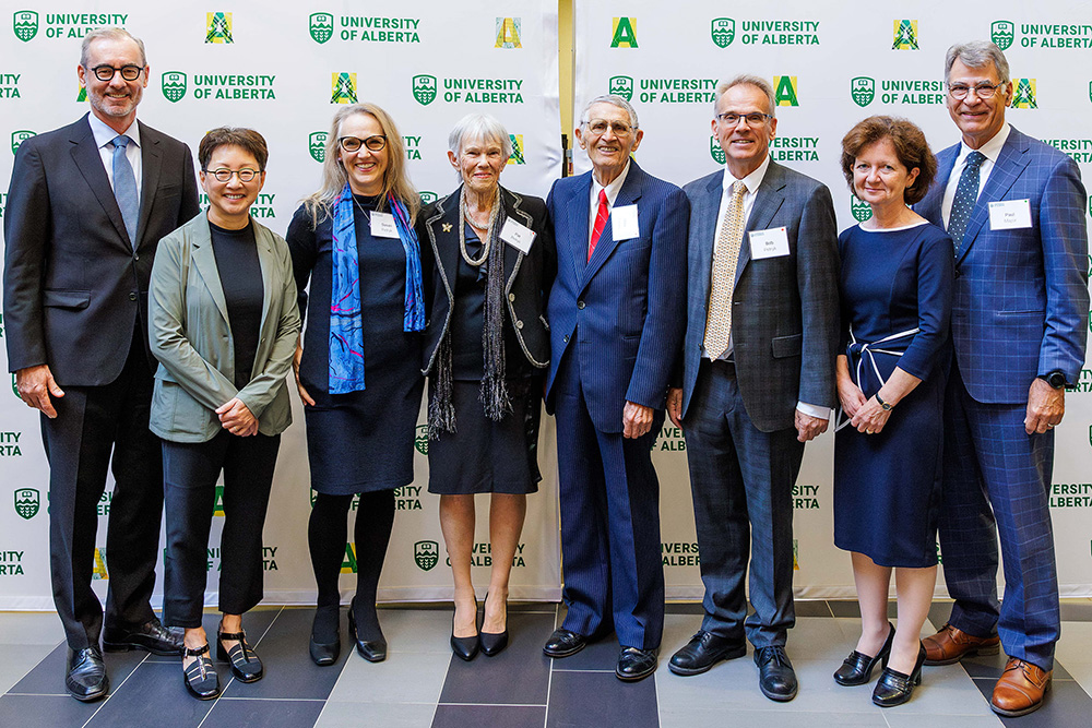 Members of the Petryk family and president Flanagan, provost Yiu, dean Hemmelgarn, and chair Major pose at an event commemorating the naming of the Mike Petryk School of Dentistry.