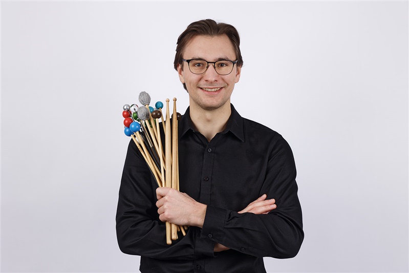 photo of Jabob Kryger holding percussion mallets