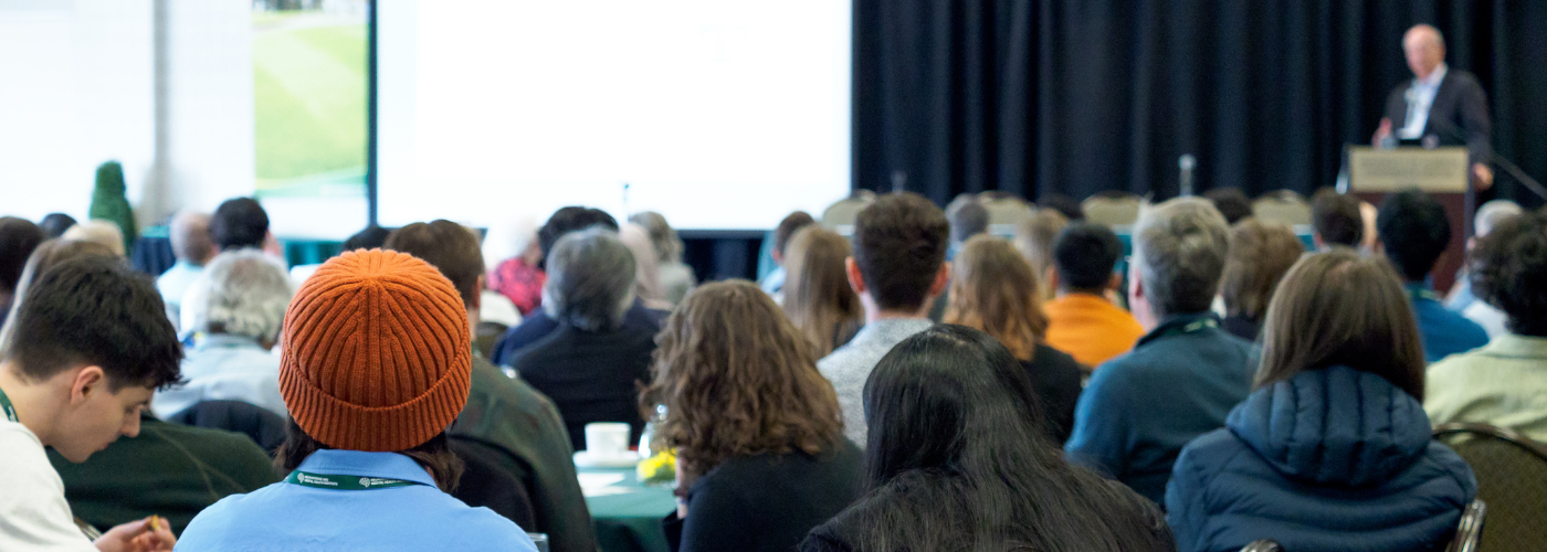 Group of people watching a presentation