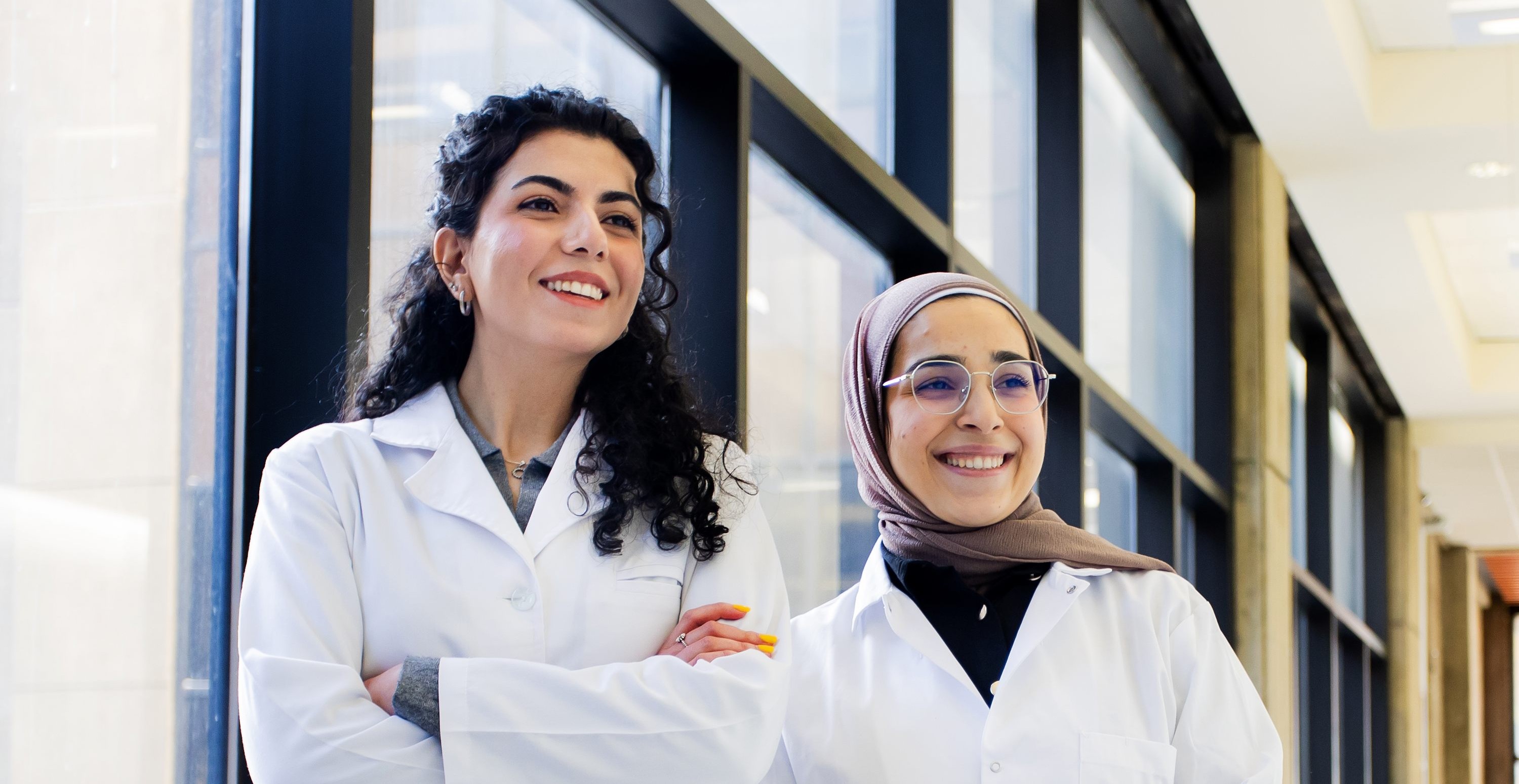 Two pharmacy students smiling