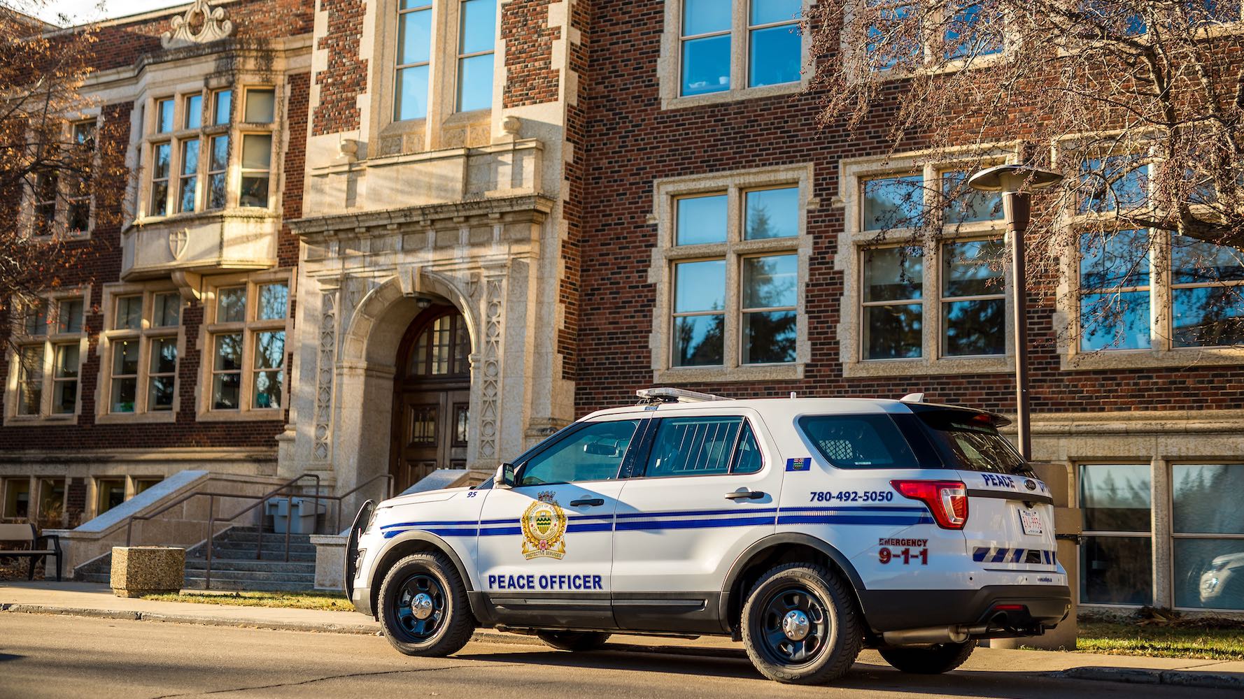 Peace officer parked at Corbett Hall on North Campus