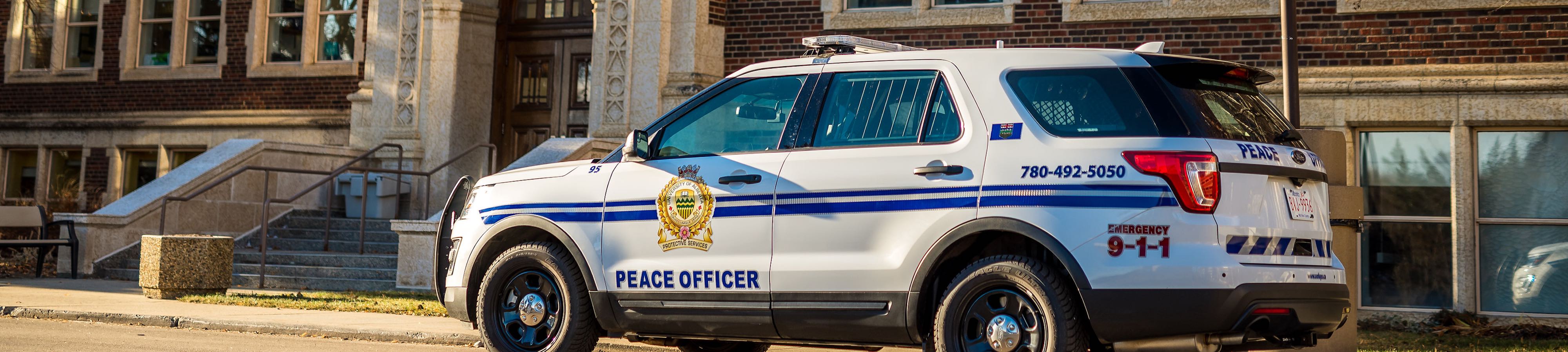 Peace officer parked at Corbett Hall on North Campus
