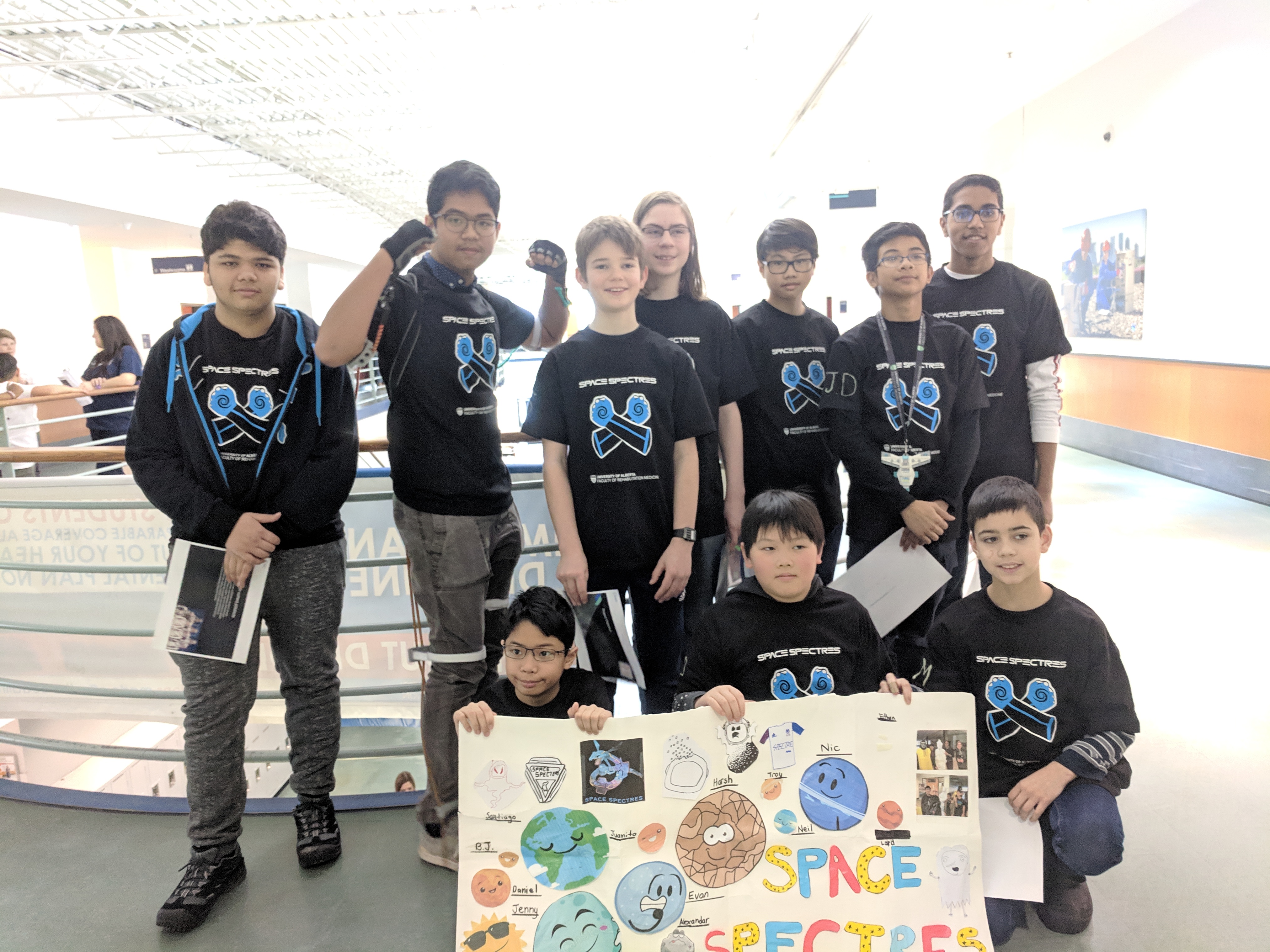 FIRST LEGO League team members working together in Dr. Kim Adams' robotics lab