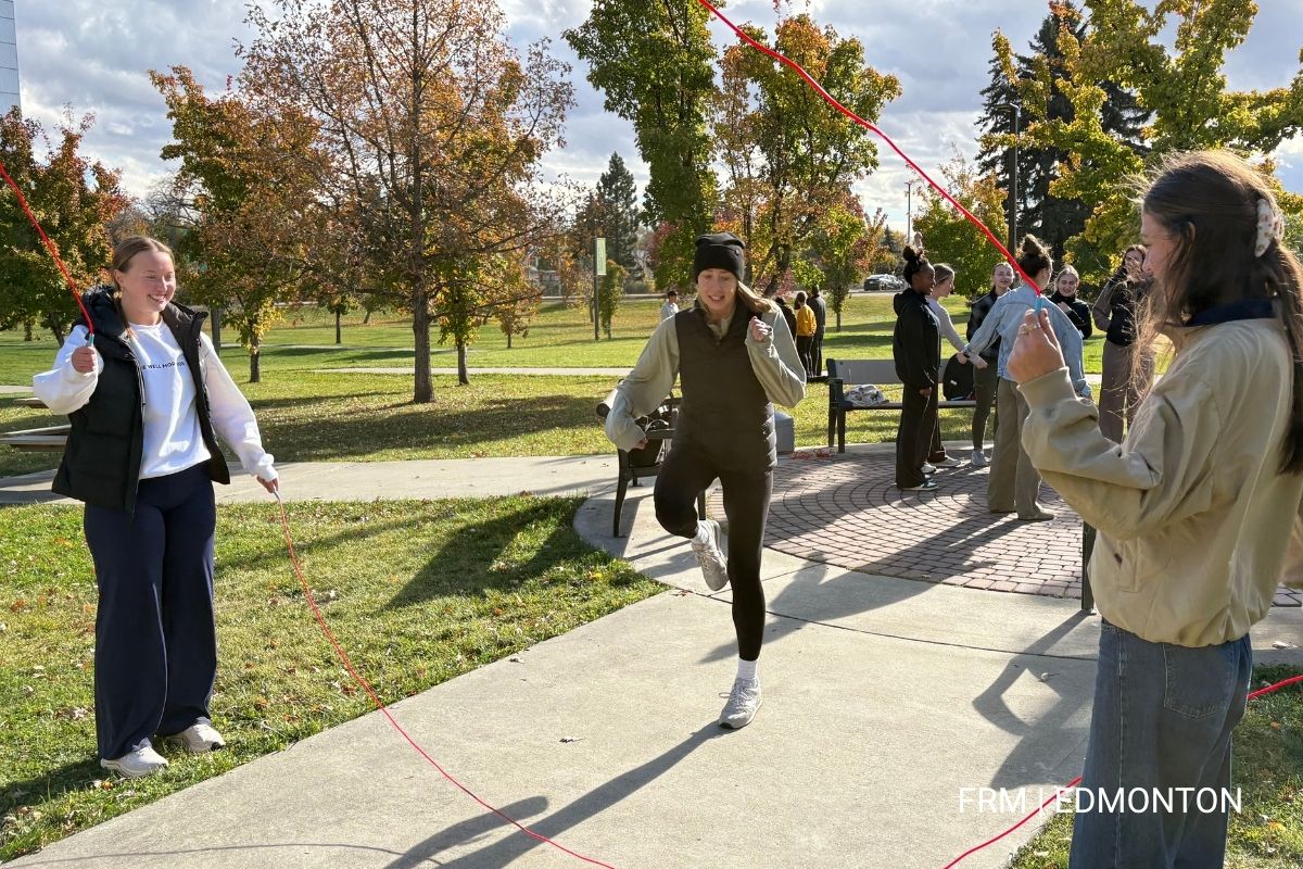 Students jumping rope in front of Corbett Hall