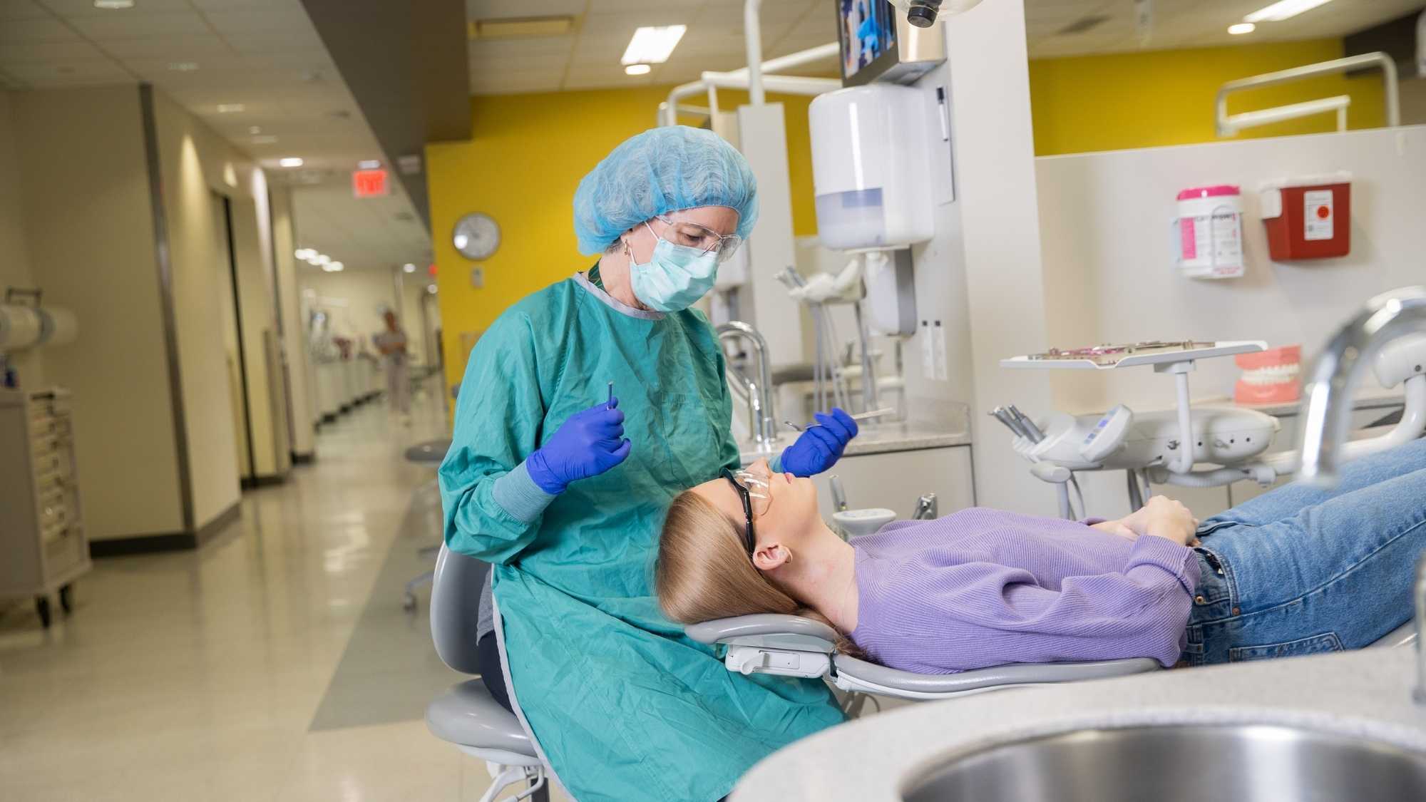 Patient and hygienist in clinic