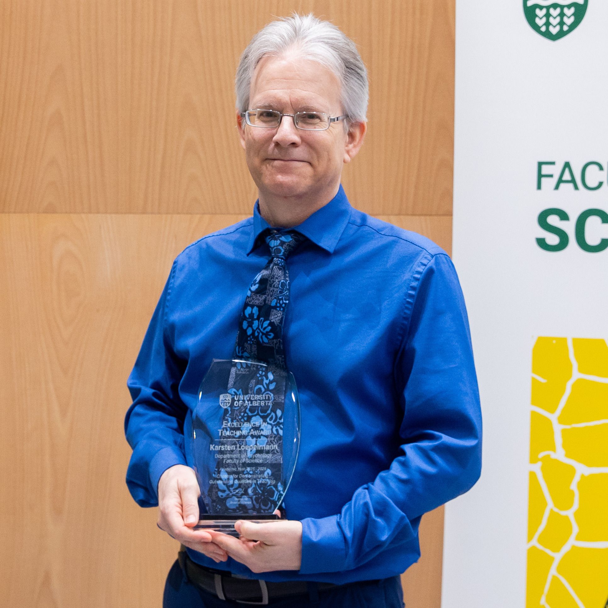 Photo of Karsten Loepelmann receiving an award at the 2026 Celebration of Excellence.