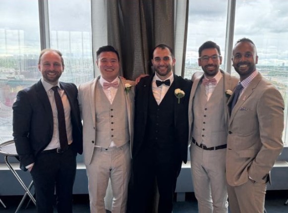four men in suits
