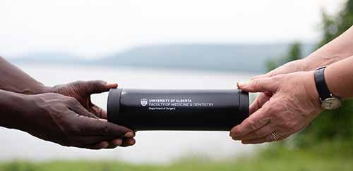 tumbler and two hands