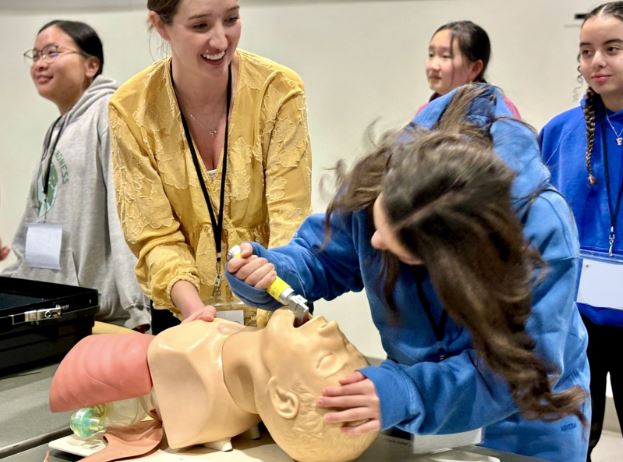 woman training a student in suturing
