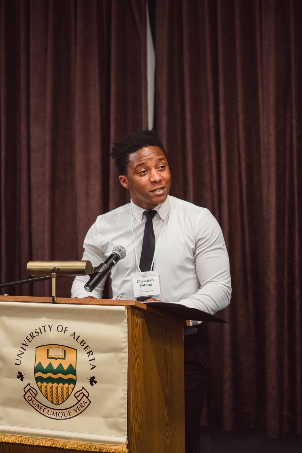 Christian Fotang, President of the University of Alberta Students' Union, congratulates award recipients