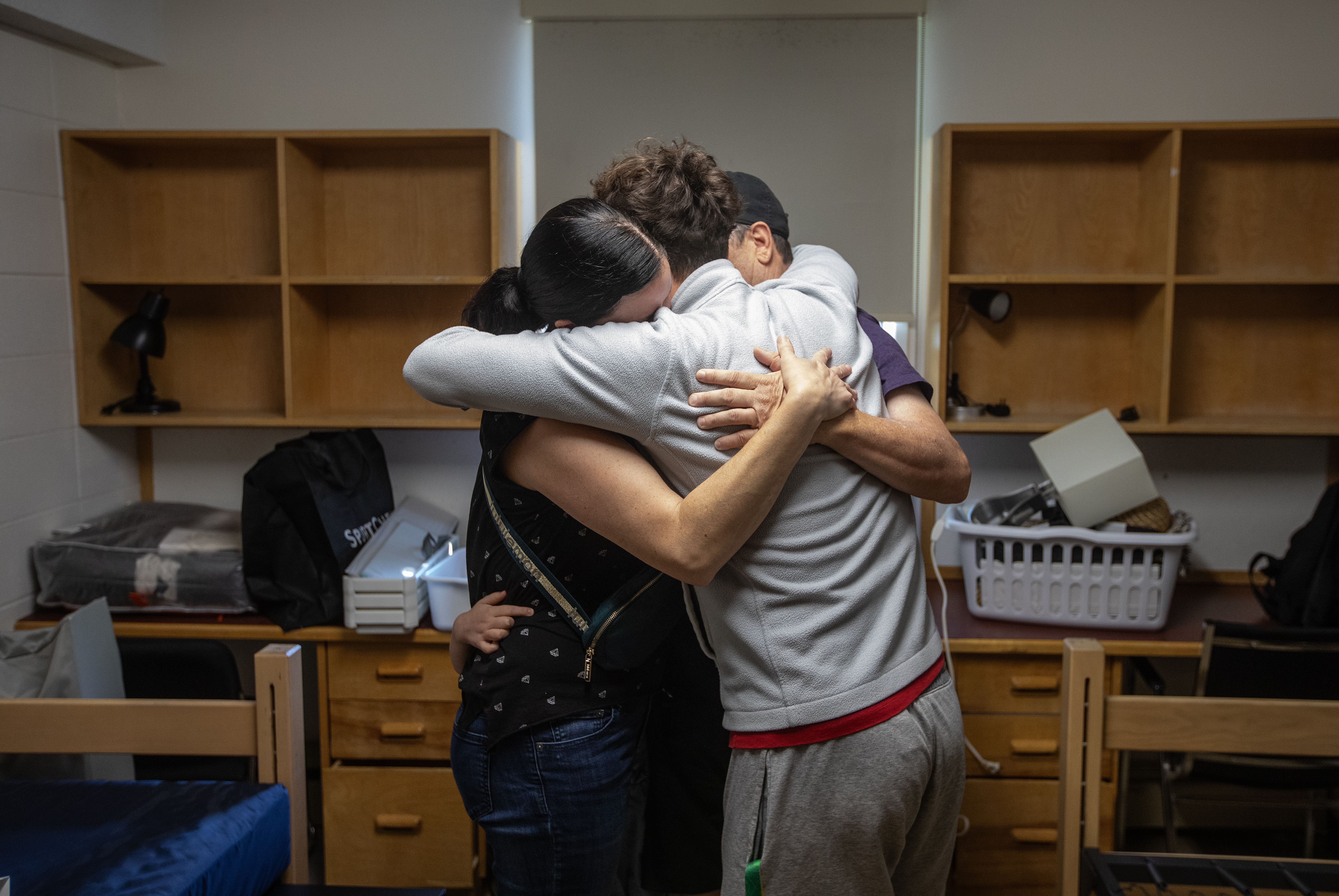 A family embracing in one of the dorm rooms at Augustana Campus during Move-In Day. After posting this photo to Instagram, the family reached out to share how touched that such “a big moment” for their family was captured. (Photo: Jason Franson)