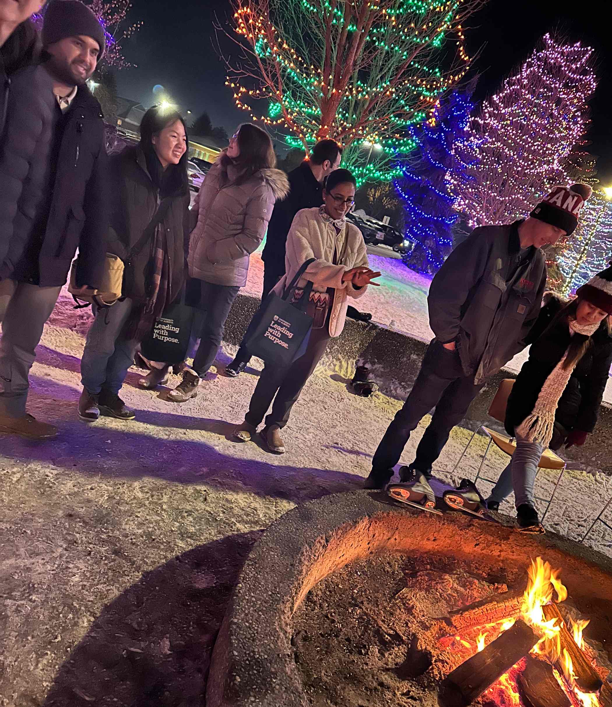 International students stand by the bonfire in Spruce Grove's Central Park.