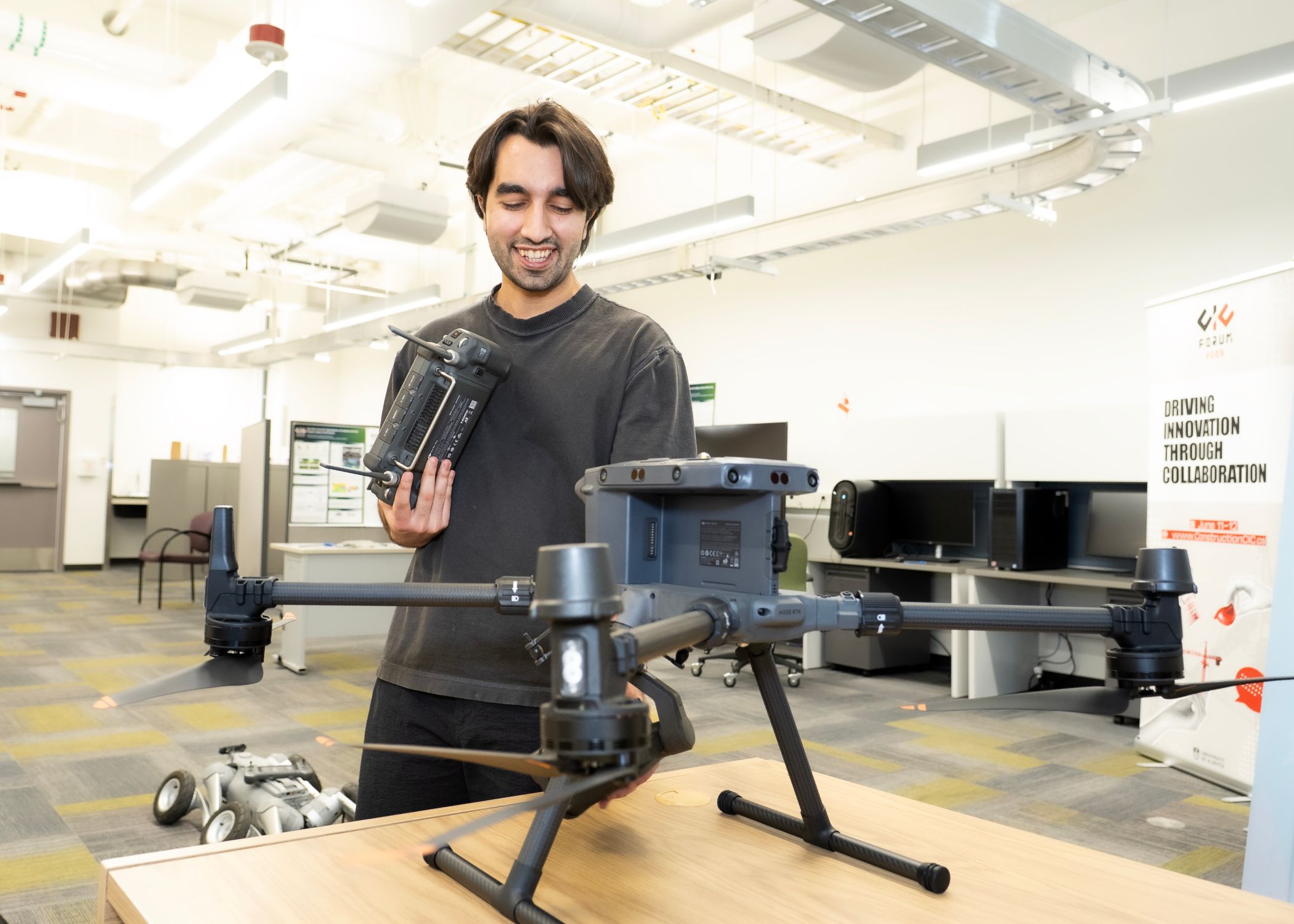 Graduate research assistant fellow Muhammad Talha introduces a heavy-lift drone with sensors for inspection research.