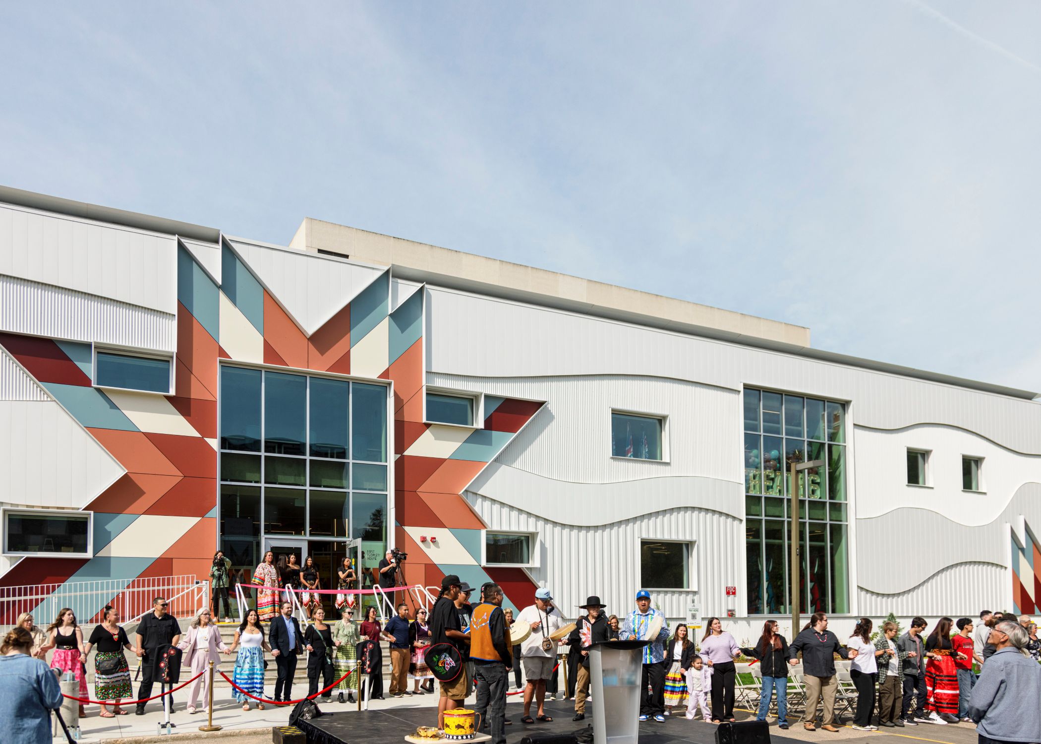 People join hands in a round dance at the ceremonial opening of the new First Peoples’ House.