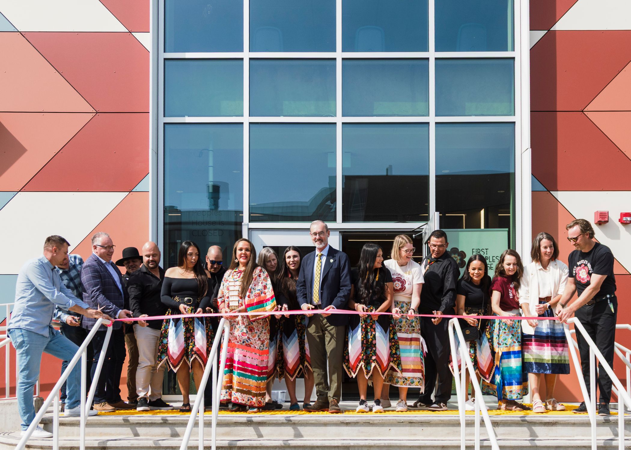University of Alberta leadership, First Peoples’ House staff and Elders gather for the ribbon cutting at the ceremonial opening of the new First Peoples’ House.