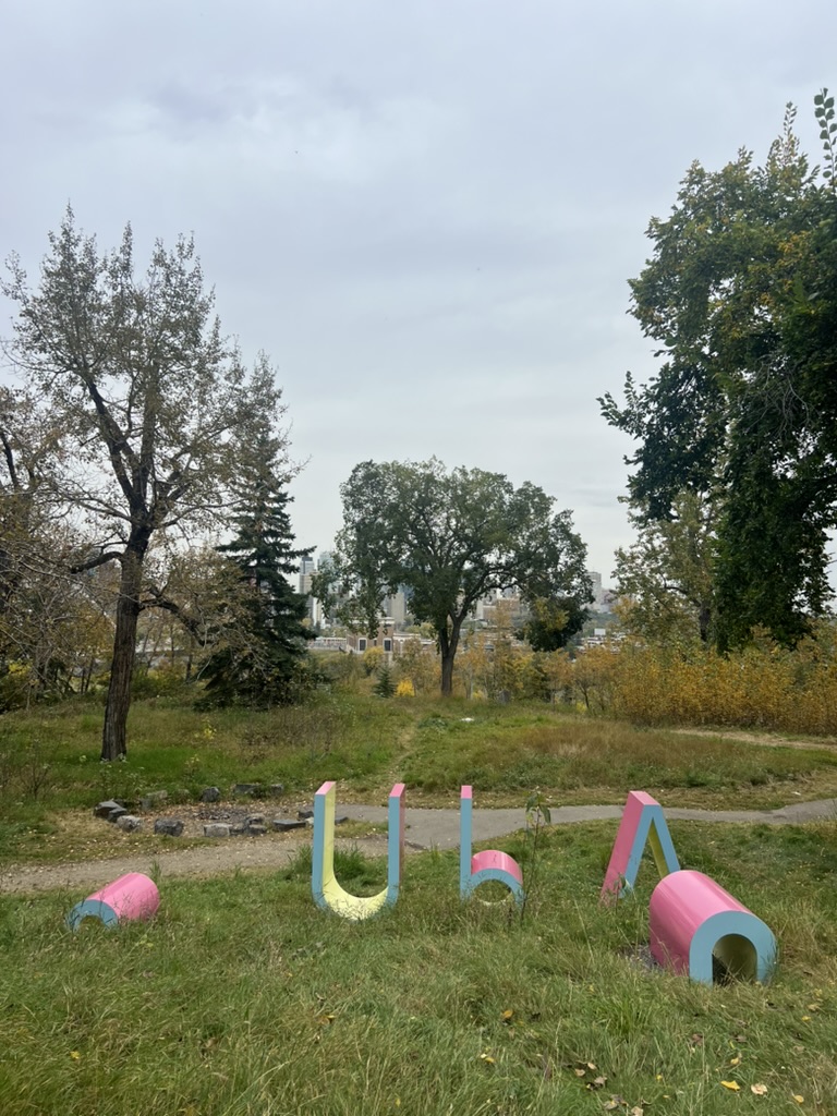 Art installation surrounded by autumn trees at Queen Elizabeth Park