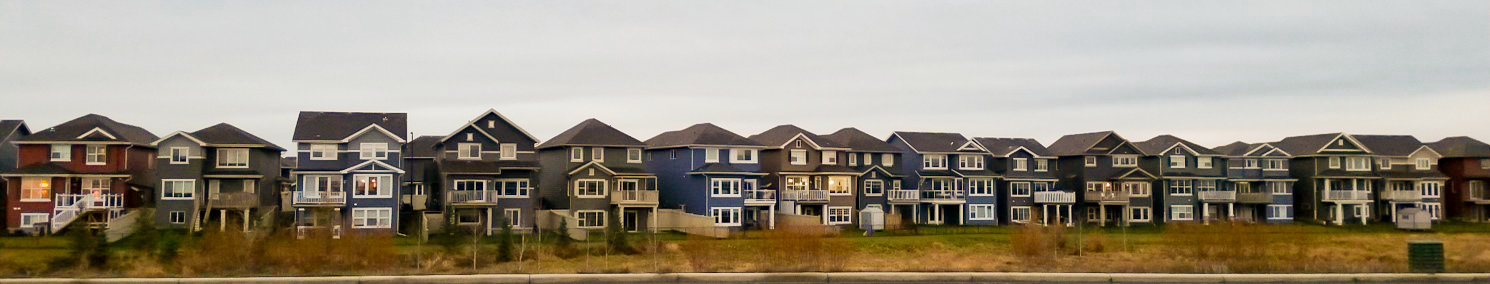 A row of single-detached homes in a developing neighbourhood in Edmonton.