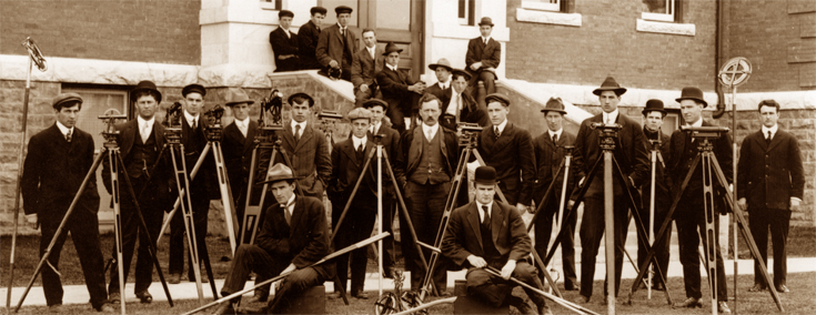 U of A founding President, Henry Marshall Tory (centre), with a civil engineering class and professor William Muir Edwards, at far right.