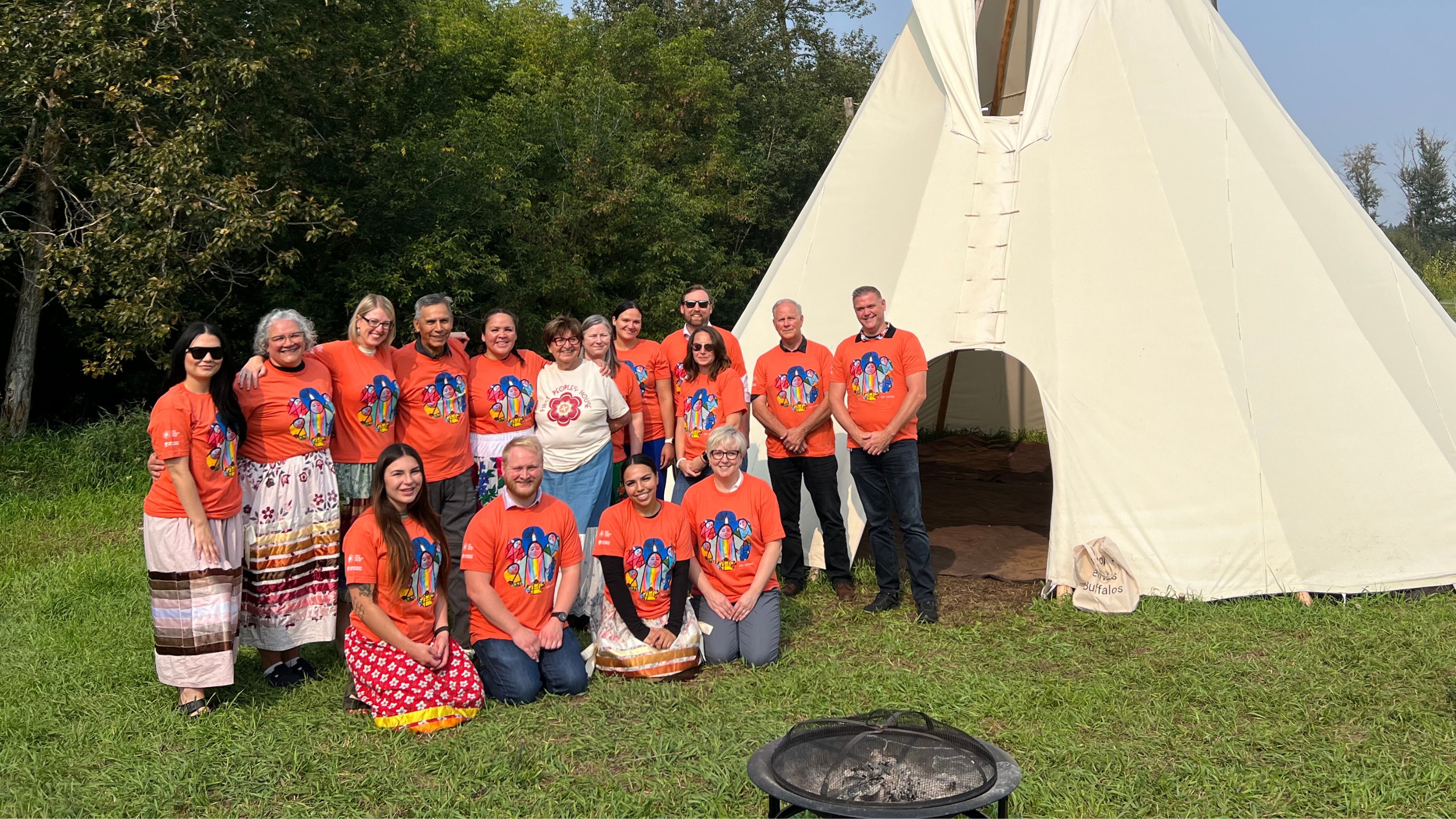The staff of First Peoples' House in front of a tipi