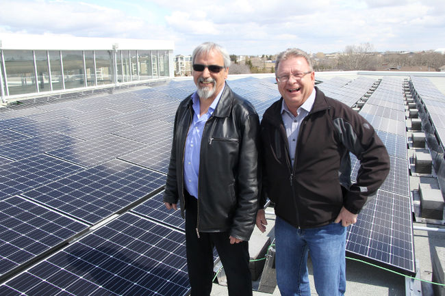 University of Alberta-Augustana project coordinator Mike Clermont (left) and facilities and operations manager Christopher Blades show off the recently completed solar project on top of the Augustana forum building in Camrose on April 28. The school now has the capability to produce 252 kilowatts per hour of energy. Josh Aldrich/ Camrose Canadian