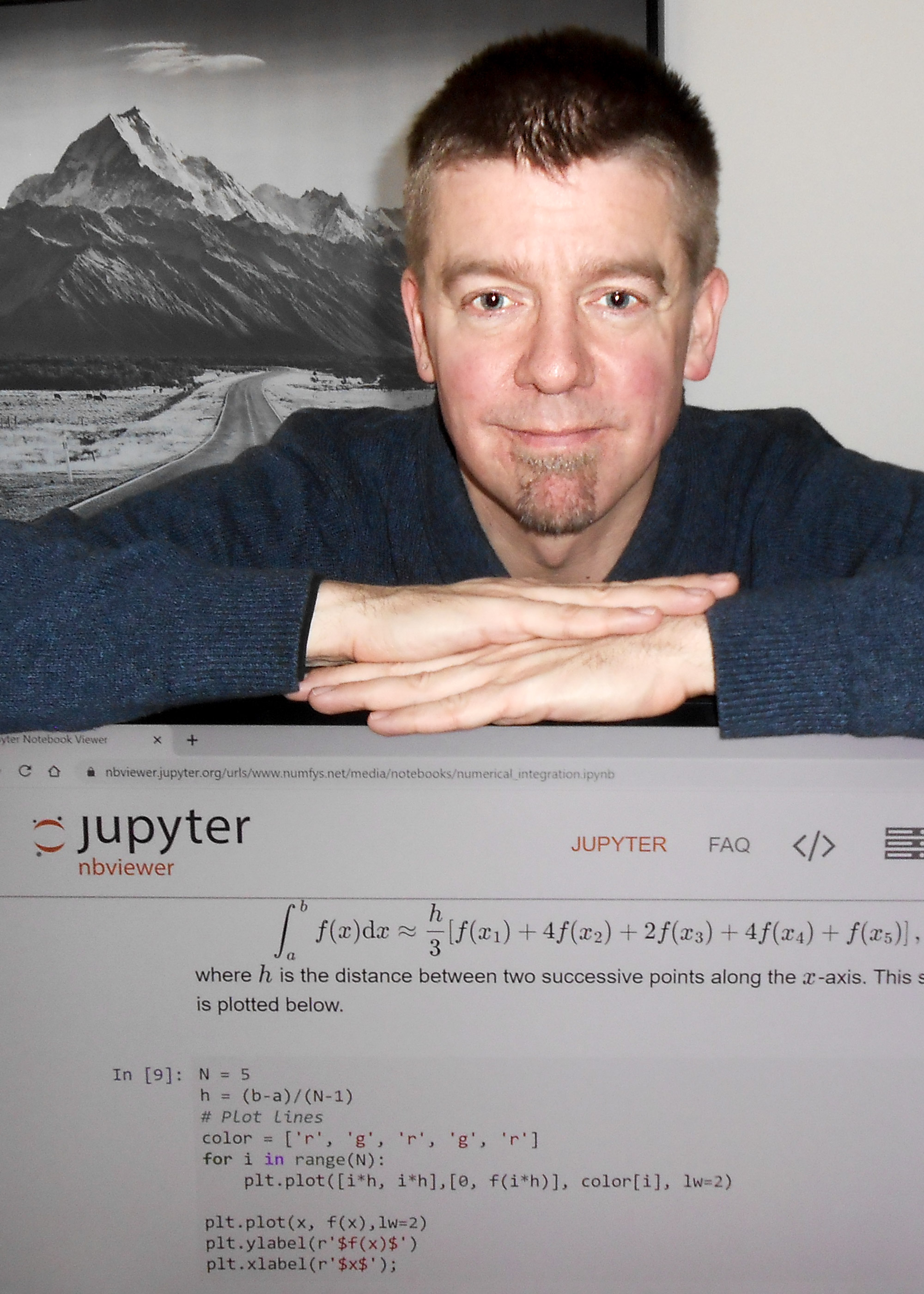 Dr. Peter Berg posing with a computer displaying Jupyter Notebook