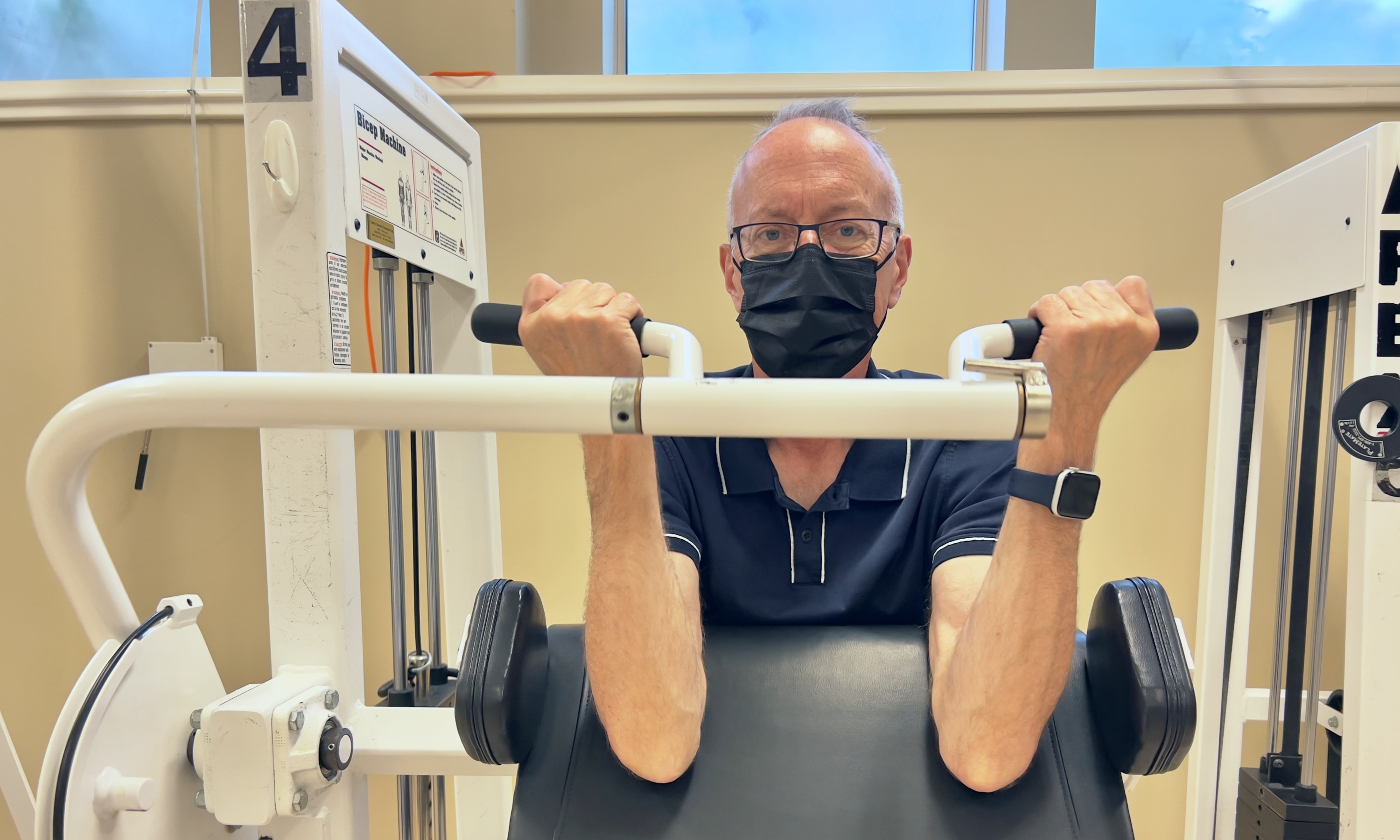 Dave Jamieson works out to build his strength after undergoing treatment for throat cancer. The well-known sports broadcaster says taking part in a U of A study on exercise for cancer survivors has changed his life for the better. (Photo: Nate Lam)
