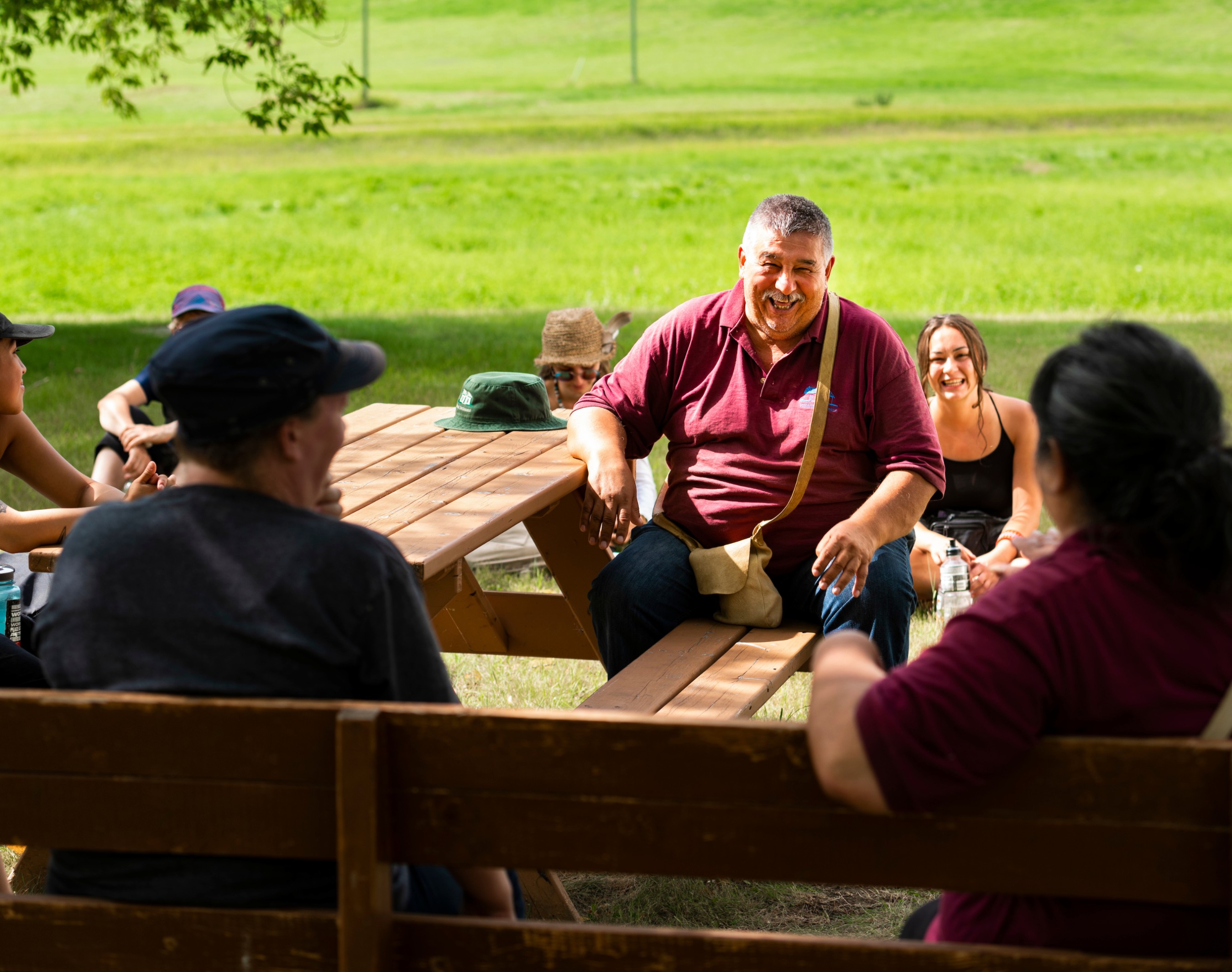 A Métis knowledge holder speaks with Native studies students during a land-based learning experience at Métis Crossing and Victoria Settlement in August 2022. (Photo: John Ulan)