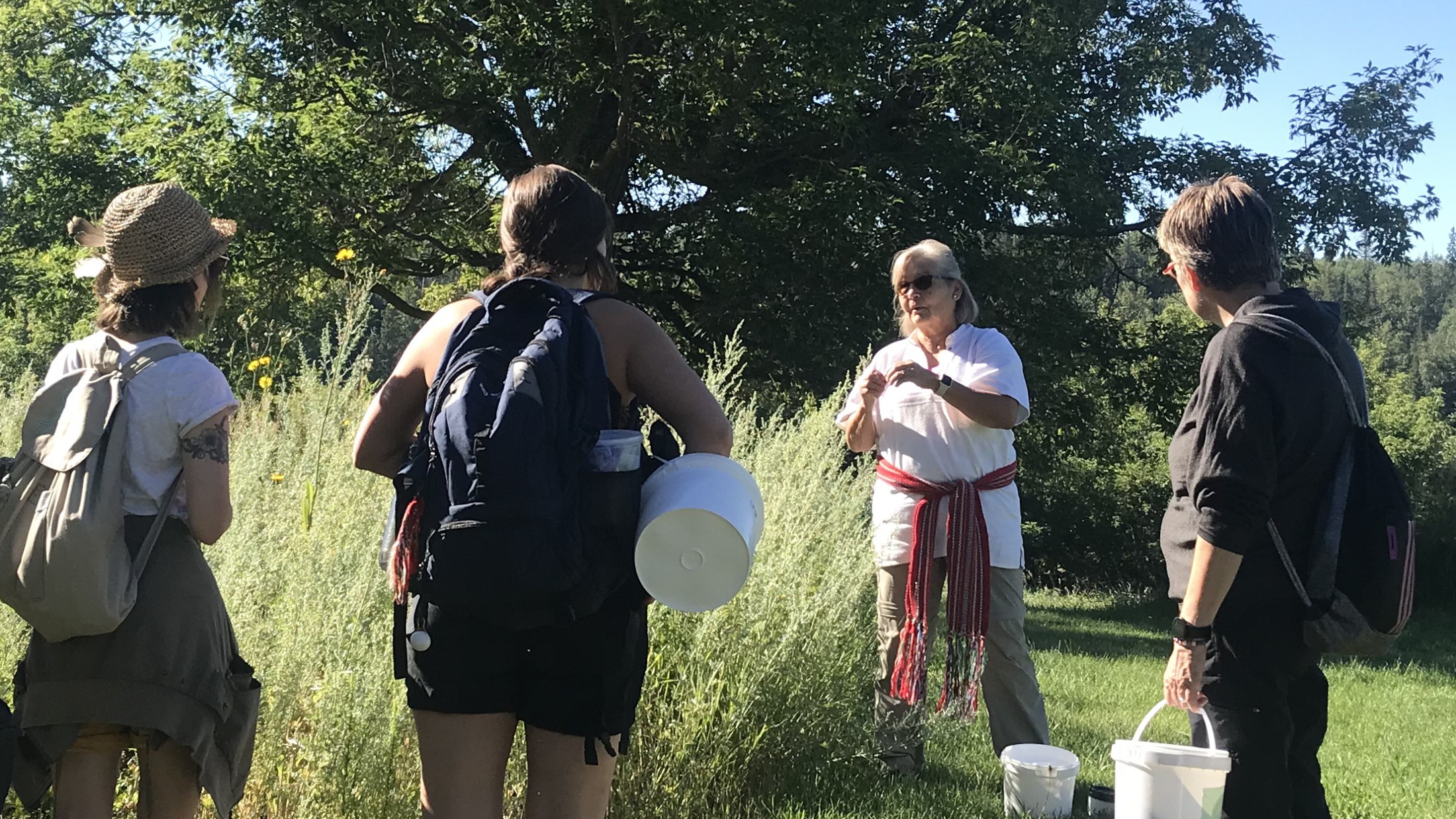Métis Elder Lilyrose Meyers guides U of A Native studies students in a harvesting exercise during a week of land-based learning at Métis Crossing.