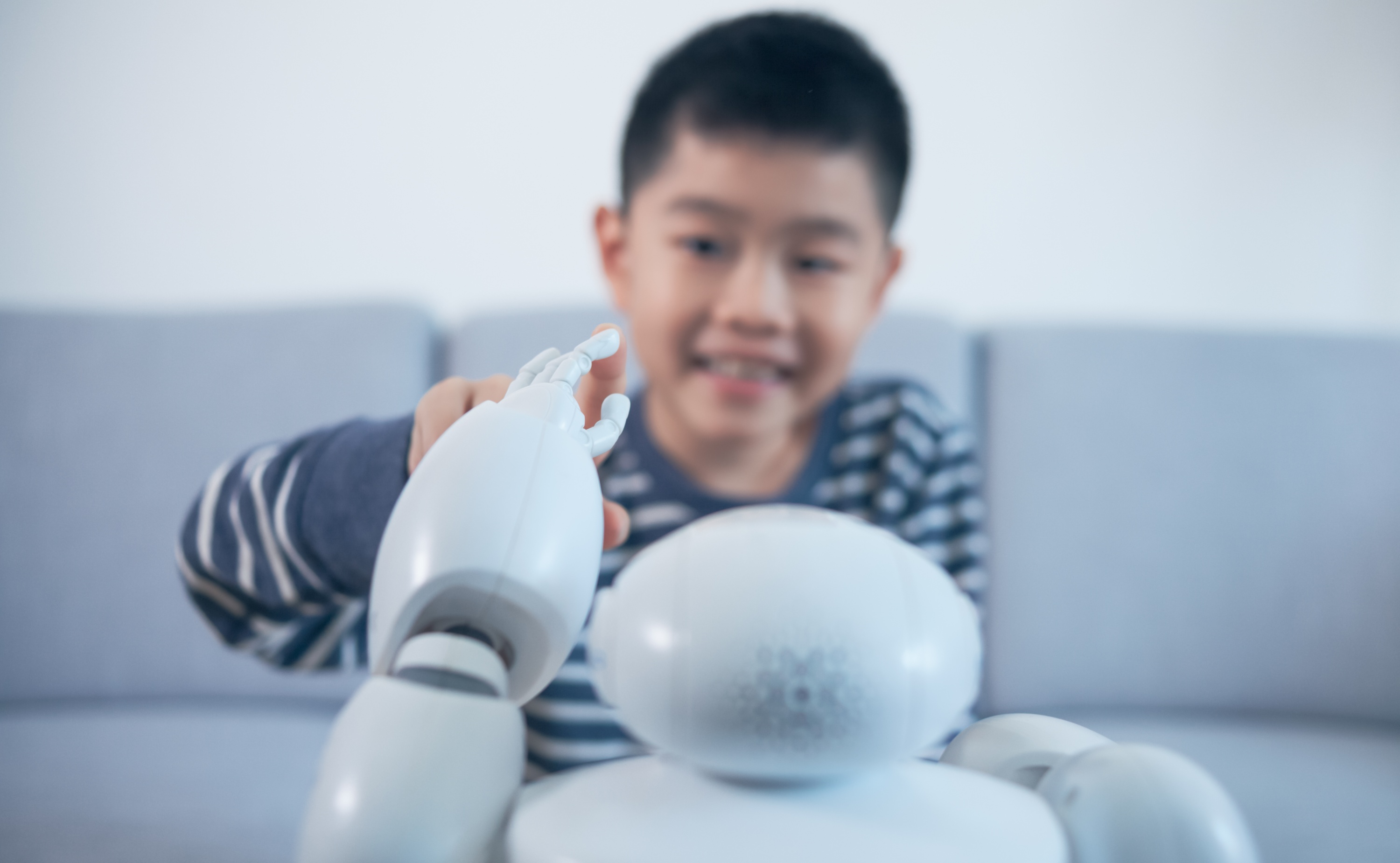 Child interacts with a robot