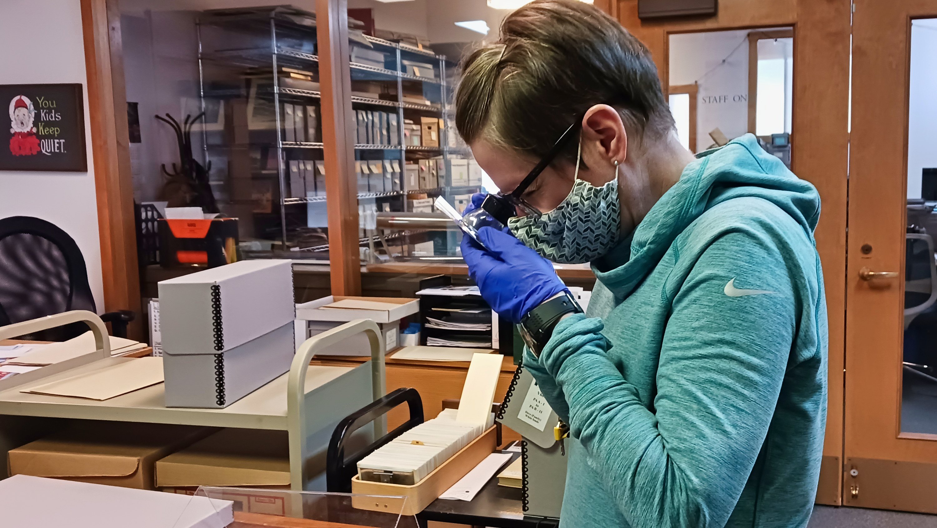 Grad student Lyndsay Conrad examines rare ski images at the archives of the Whyte Museum of the Canadian Rockies in Banff. (Photo: PearlAnn Reichwein)
