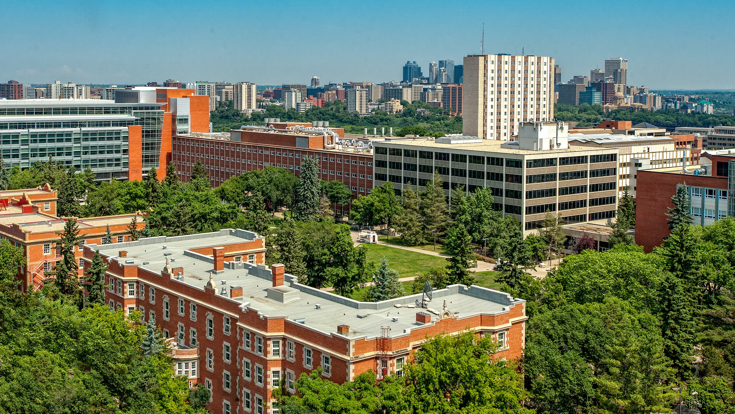 Aerial shot of the University of Alberta's North Campus with downtown Edmonton in the background (photographed by Richard Siemens)