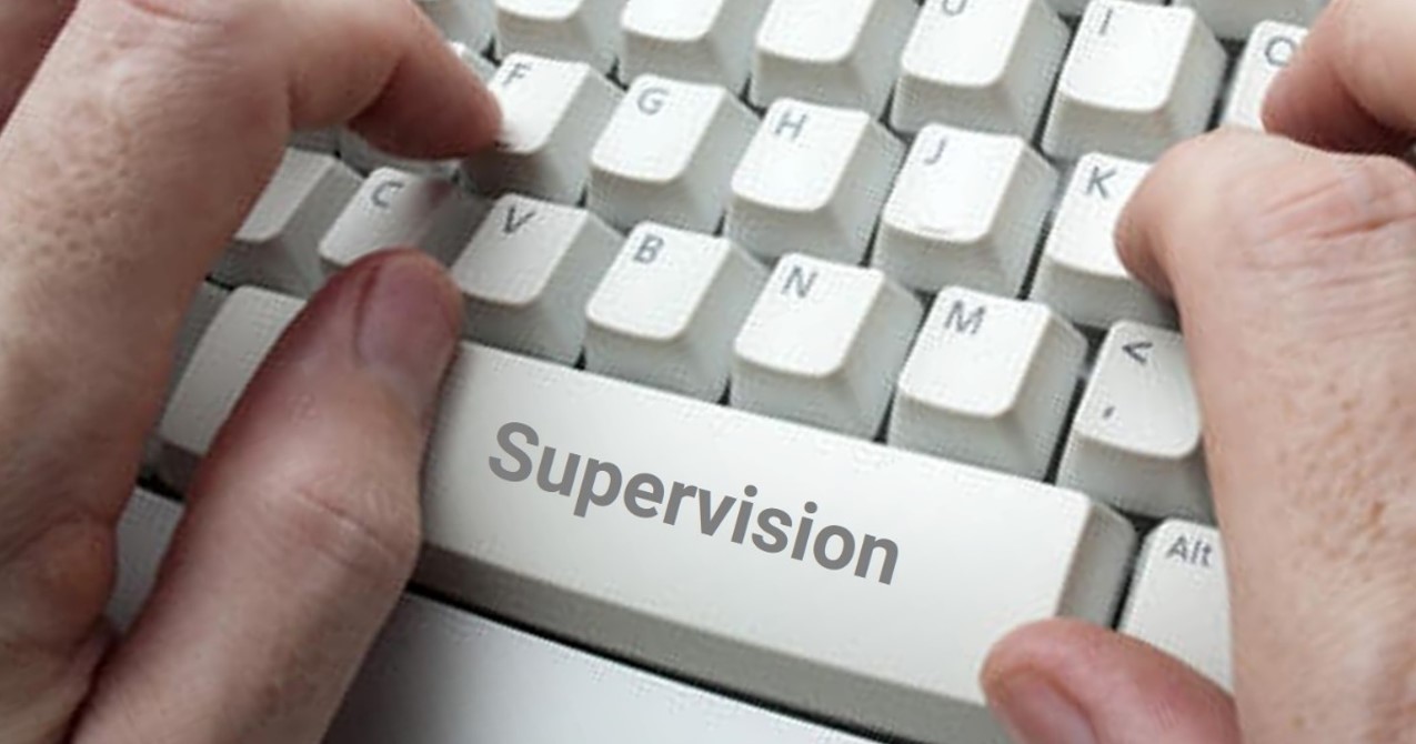 Hands on keyboard that says supervision