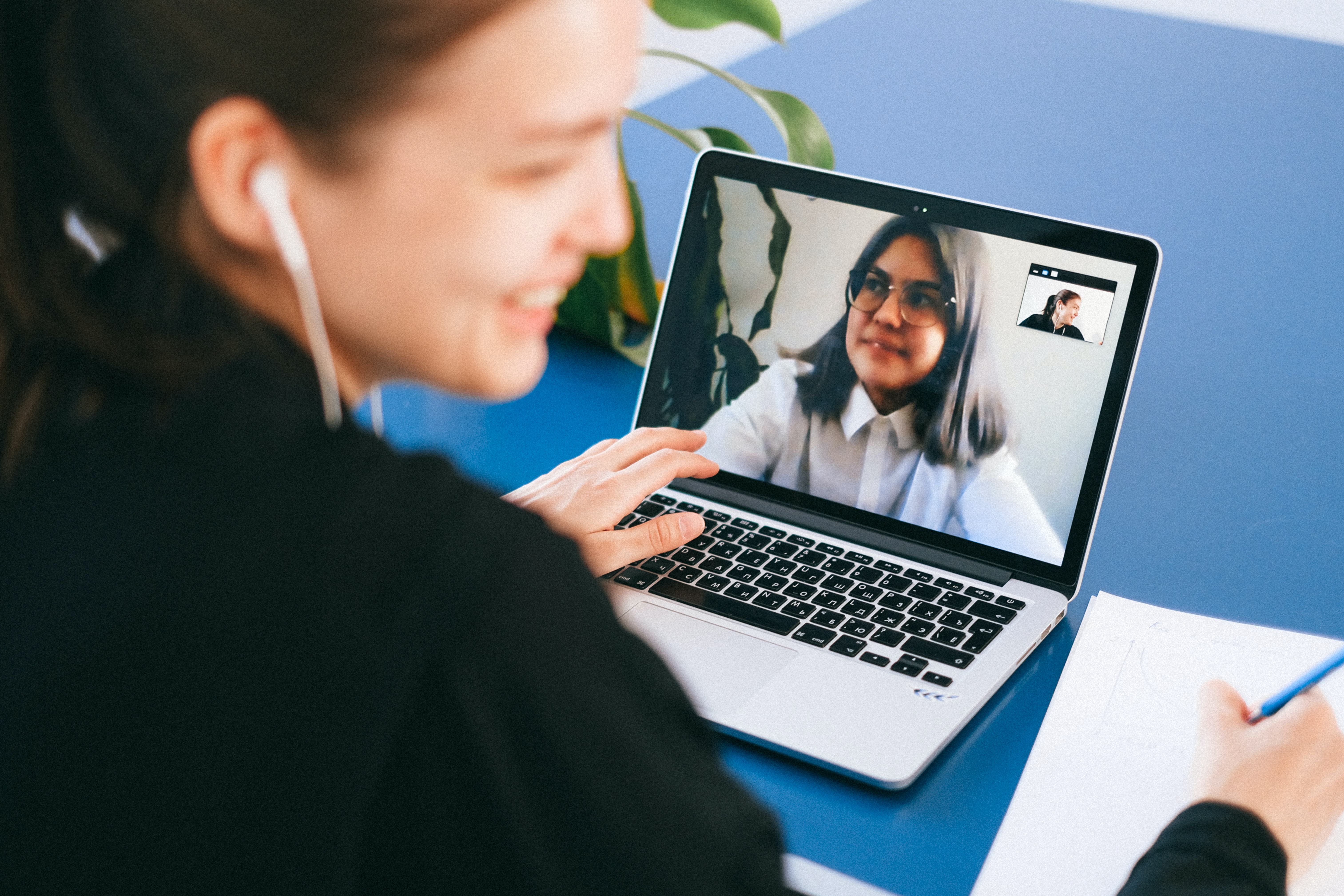 Person on laptop in a virtual meeting