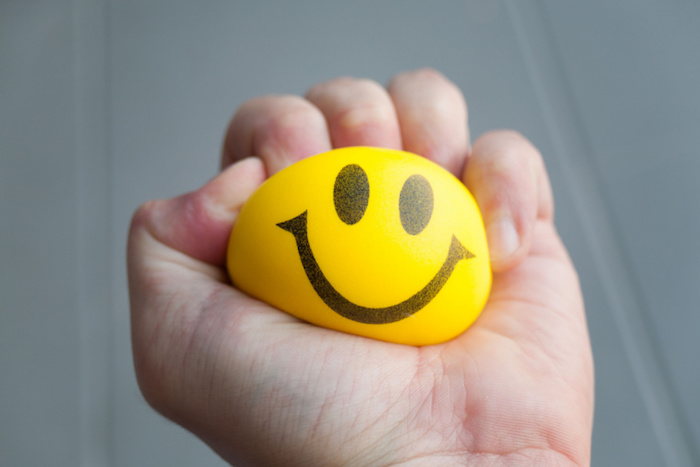 Hand Squeezing Happy Face Stress Ball