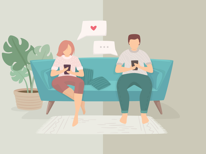 couple on couch on phones