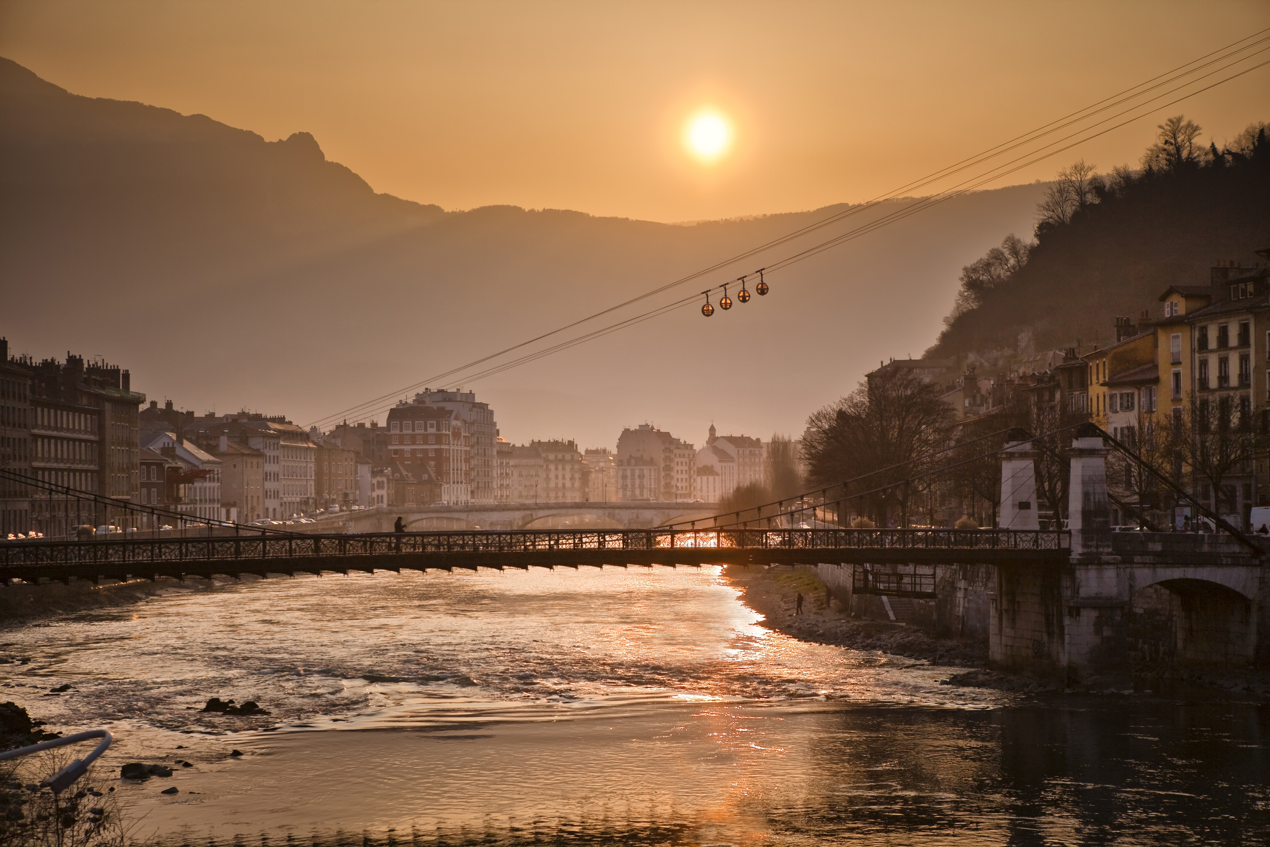 Image of the town of Grenoble with a sunset 
