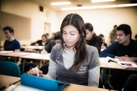 student with computer in classroom