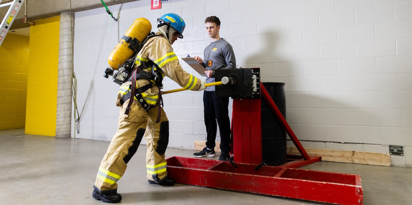 Applicant hitting a pressure sensor with a sledge hammer