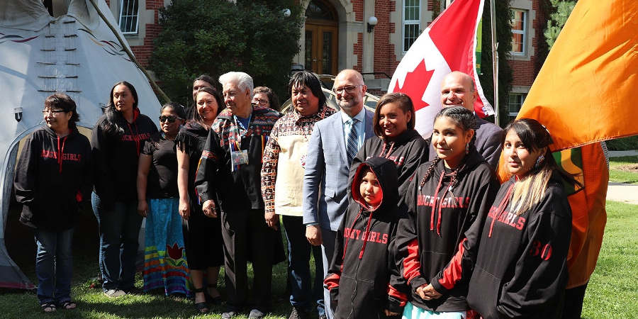 Members of the Aseniwuche Winewak Nation joined (from fifth left) Native studies professor Shalene Jobin, Elder Gilman Cardinal, law professor Hadley Friedland, AWN president Tom McDonald, Justice Minister and Attorney General David Lametti, and Edmonton Centre MP Randy Boissonnault to announce funding for the Wahkohtowin Law and Governance Lodge today. (Photo: Supplied)