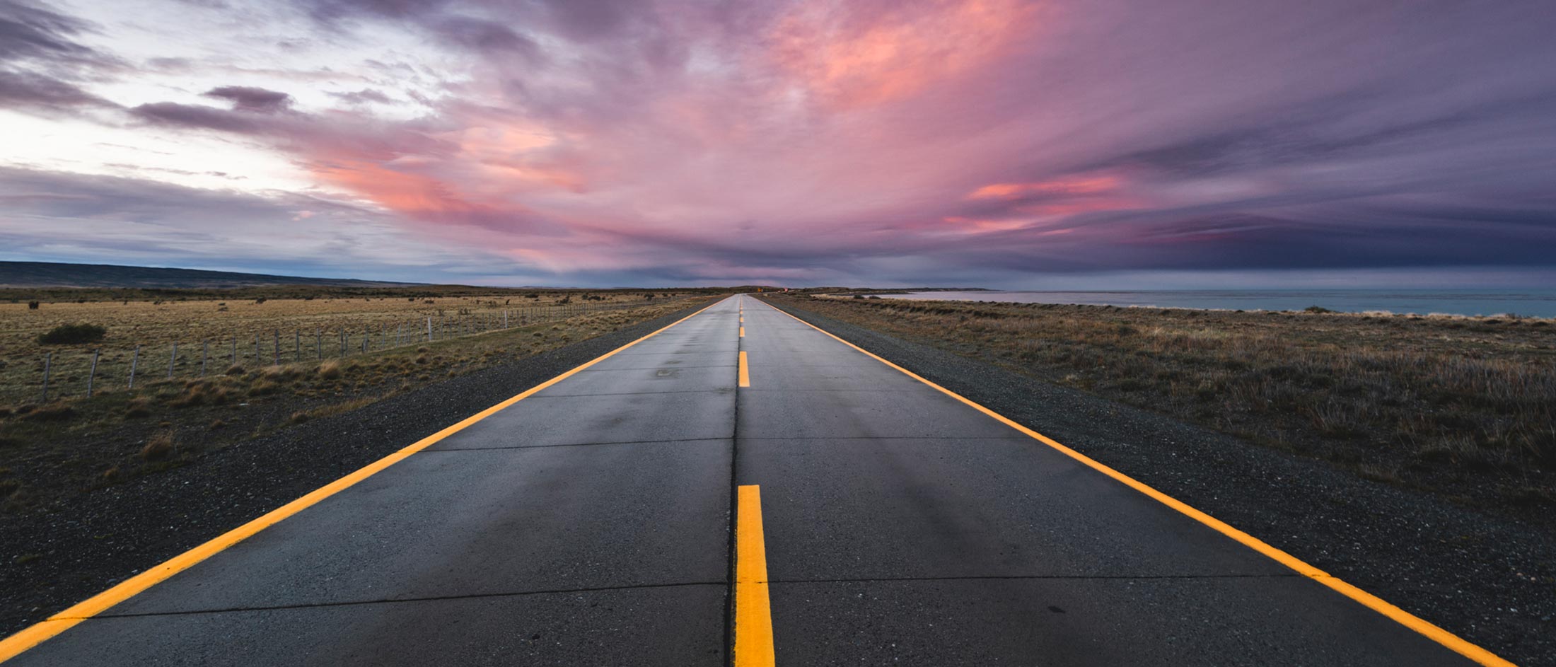 An empty road stretches to the horizon