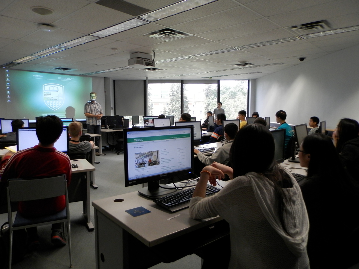 Instructor teaching a computer coding workshop.