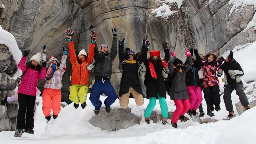 students jumping winter