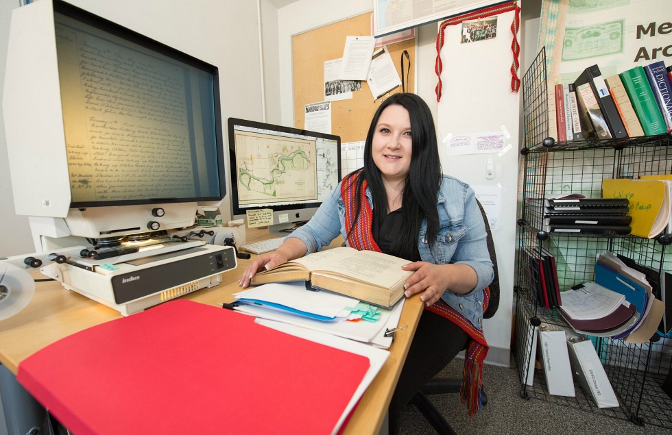 Kayla Lar-Son, BA NS '16, pores over the Métis archives in the Faculty of Native Studies.