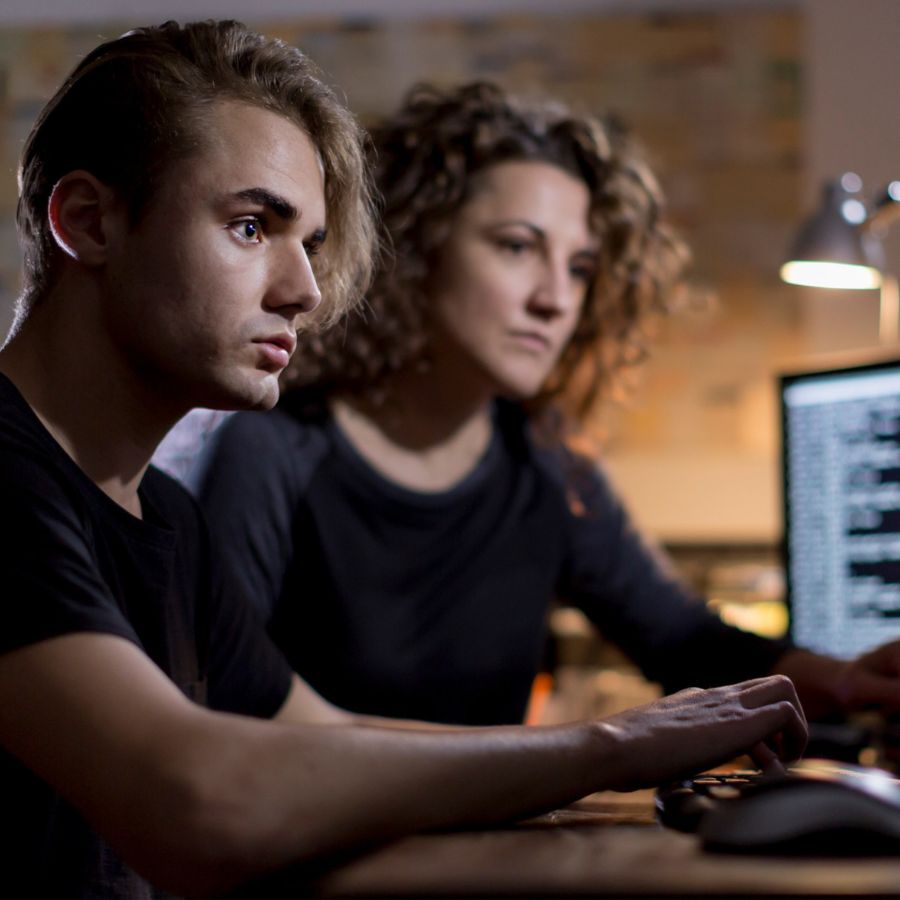 Woman and man using computers