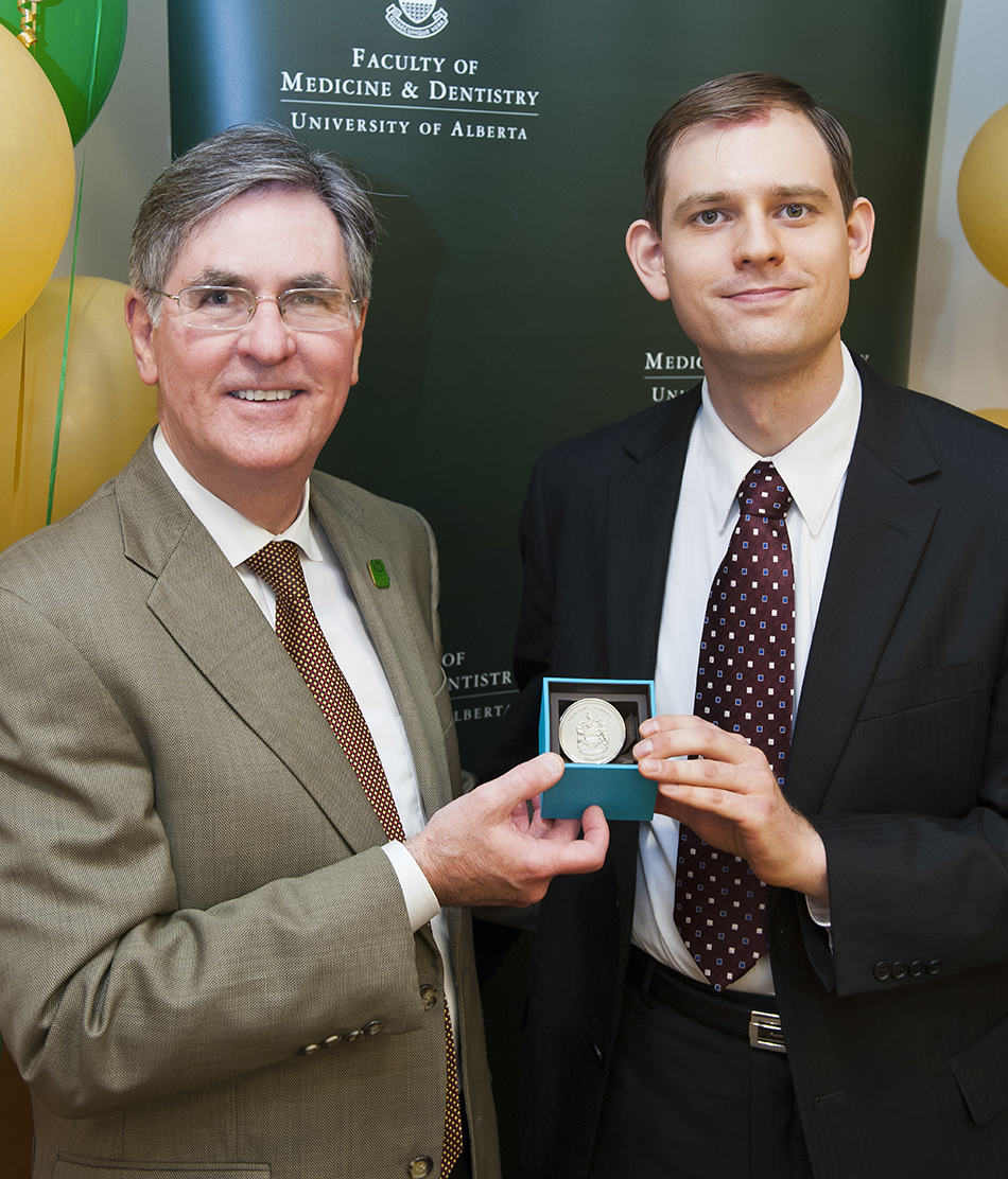 Douglas Miller, dean of the Faculty, with Owen Stechishin, the Alberta Premier Silver Medal winner.